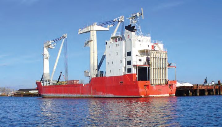 Cargo vessel with cranes attached for LOLO shipping.